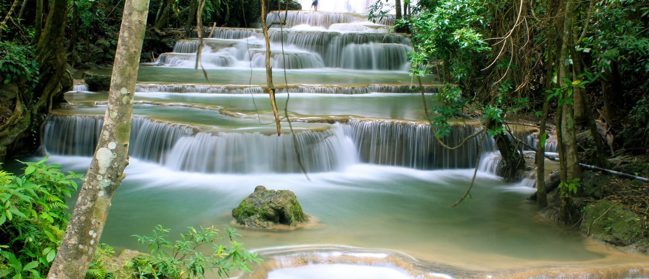 cover How about a trip to Kanchanaburi? Huai Mae Khamin Waterfall, the Emerald Stream of the Western Forest.