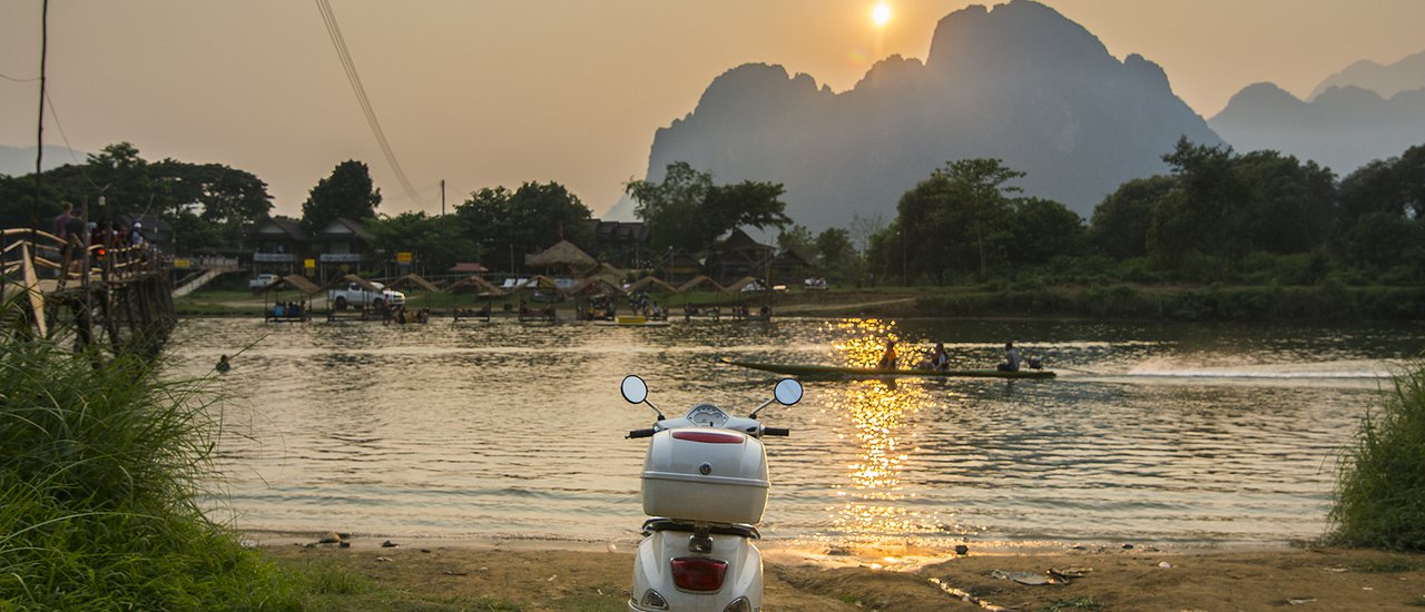 cover Riding a two-wheeled vehicle to open a Singha in the city of Laos...!!!