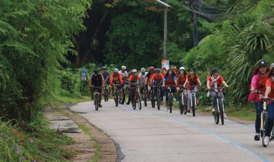 cover Volunteer to cycle to plant trees, take a leisurely walk along the Mekong River, and offer sticky rice alms in Chiang Khan.