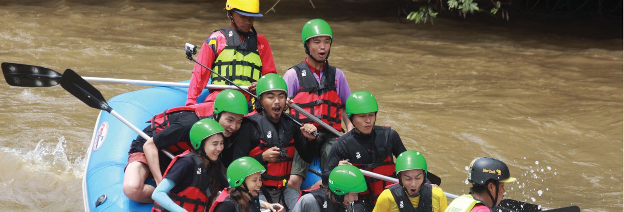 cover Whitewater rafting volunteers collect waste from the Nam Khek River, enjoying the breeze of Phu Hin Rong Kla National Park while trekking to find waterfalls.