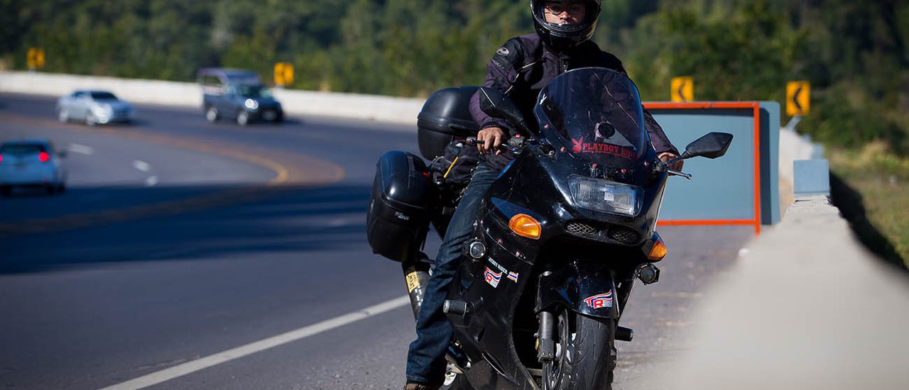 cover One person, one big bike, 20 years old, riding 3,500 km from south to north.