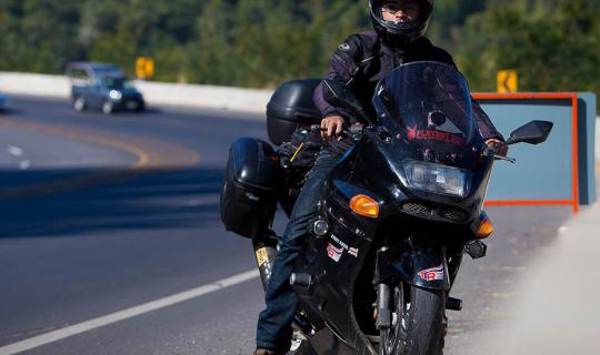 cover One person, one big bike, 20 years old, riding 3,500 km from south to north.