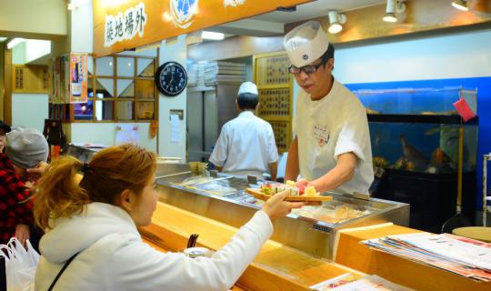 cover Waking up at four in the morning to explore the legendary Tsukiji Fish Market...