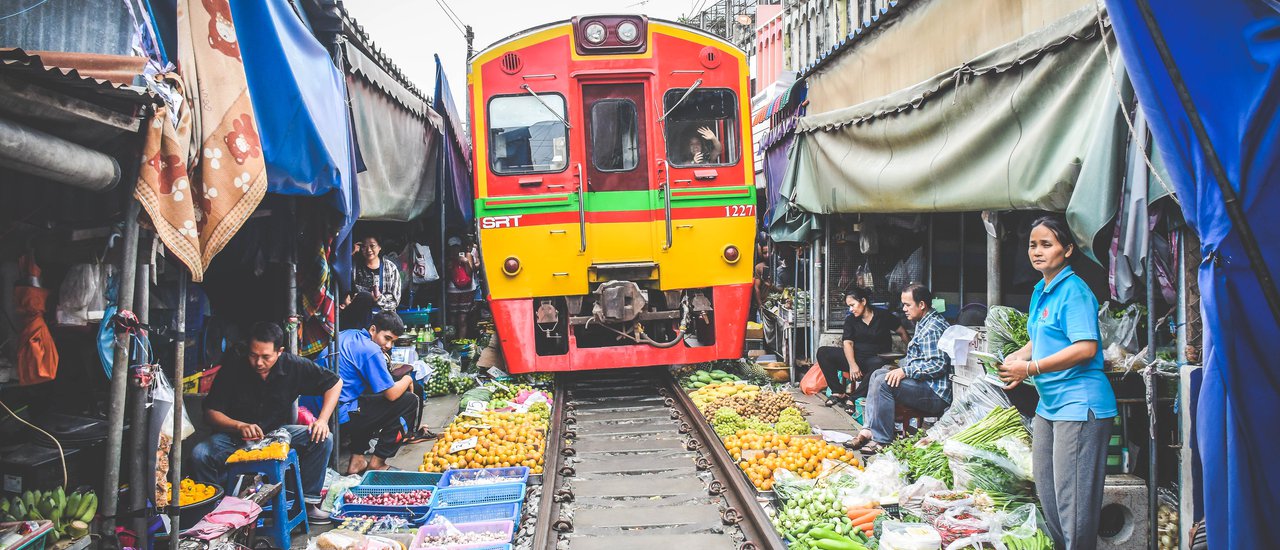 cover Ride the Free Train to Explore UNSEEN THAILAND: "The Collapsible Umbrella Market"