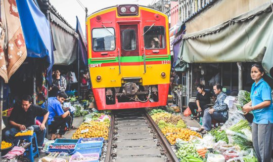 cover Ride the Free Train to Explore UNSEEN THAILAND: "The Collapsible Umbrella Market"