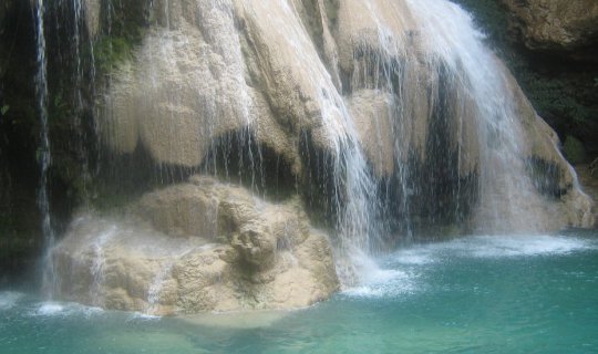 cover UNSEEN Lamphun: Pay respects at Phra That Hariphunchai, admire the stunning Wat San Pa Yang Luang (ranked among the most beautiful temples in Thailand), and have fun splashing around in the refreshing, emerald-green waters of Ko Luang Waterfall!