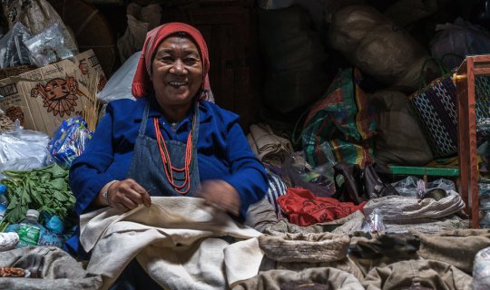 cover Chiang Tung, the city of a hundred temples, on a day when the green fields meet the cloudy sky.