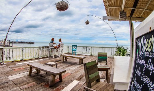 cover Take a free train ride to relax at Sam Guesthouse, located on the beachfront in Hua Hin.