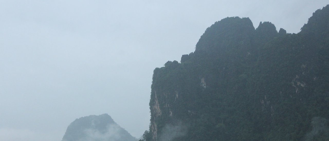 cover Strolling through the refreshing rain in Vang Vieng.