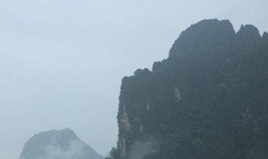 Cover Strolling through the refreshing rain in Vang Vieng....