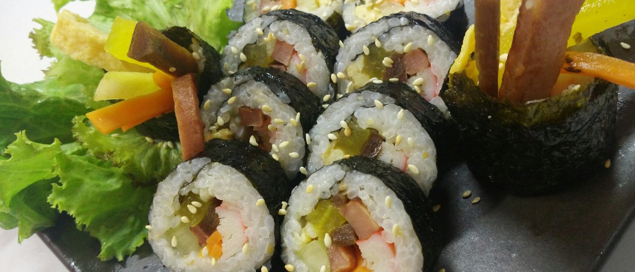 cover Kimbap, or Korean rice rolls.