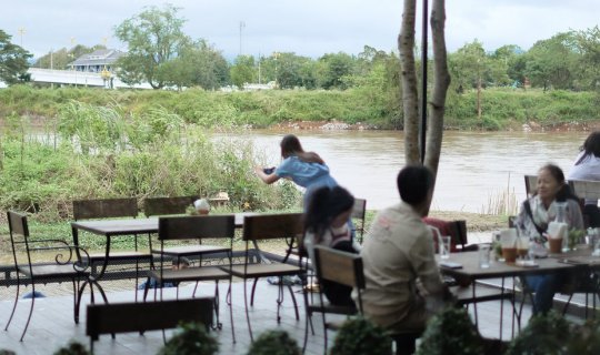 cover Enjoy a riverside meal at Melt in your Mouth, a trendy restaurant in Chiang Rai, Thailand, located along the banks of the Kok River.