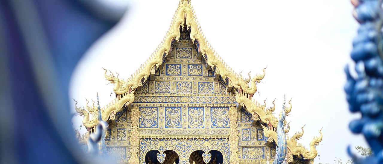 cover Stop by to pay respects at Wat Rong Suea Ten, Chiang Rai Province. The magnificent blue color is truly breathtaking.