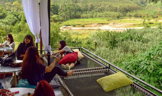 Cover Relaxing on the net, enjoying the million-dollar view of nature at a...