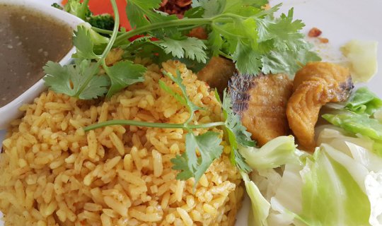 Cover "Khao Mok Pla," a dish with a name that may not be familiar, is both...