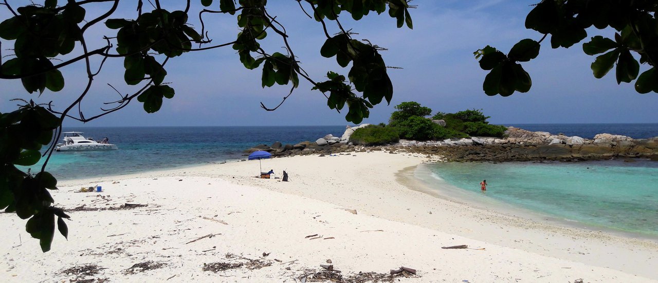 cover Phang Nga Bay's Raja Noi and Raja Yai Islands, near Phuket, witness a playful pod of dolphins frolicking in the water off Mai Khao Beach. (Video available)