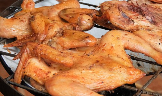 cover Grilled Chicken, Sticky Rice, and Papaya Salad at Rama 9 Grilled Chicken Restaurant.