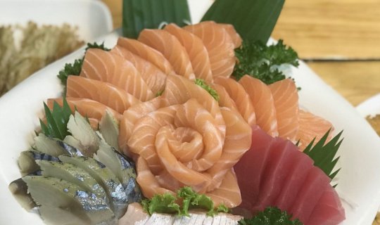 Cover Indulge in the irresistible Salmon Sashimi at Yoshi Japanese Restaur...