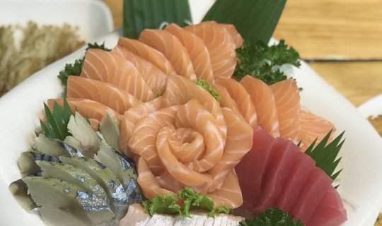 Cover Indulge in the irresistible Salmon Sashimi at Yoshi Japanese Restaur...