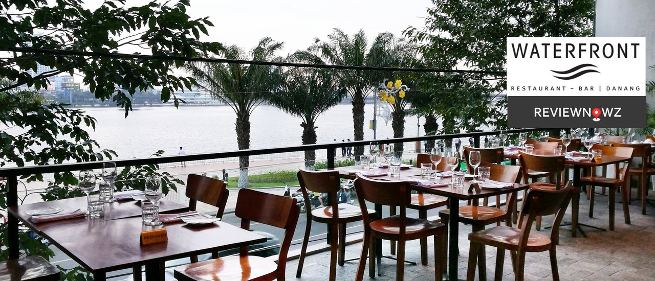 cover Enjoying Vietnamese craft beer and delicious food while admiring the scenic Hàn River at Waterfront, Danang, Vietnam.