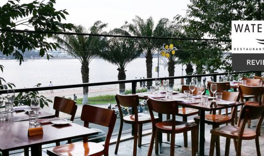 cover Enjoying Vietnamese craft beer and delicious food while admiring the scenic Hàn River at Waterfront, Danang, Vietnam.