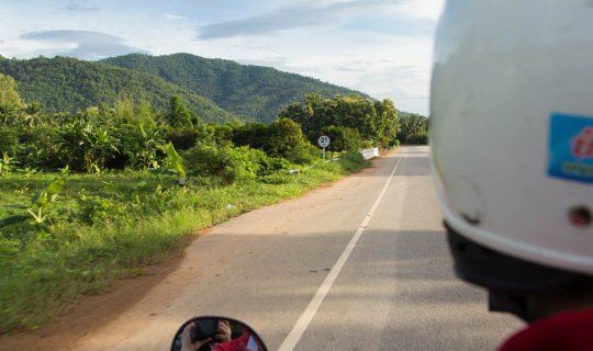 Cover Ride a wave on Highway 211 along the Mekong River....