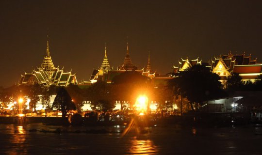 Cover A dinner cruise on the Chao Phraya River during a light drizzle....