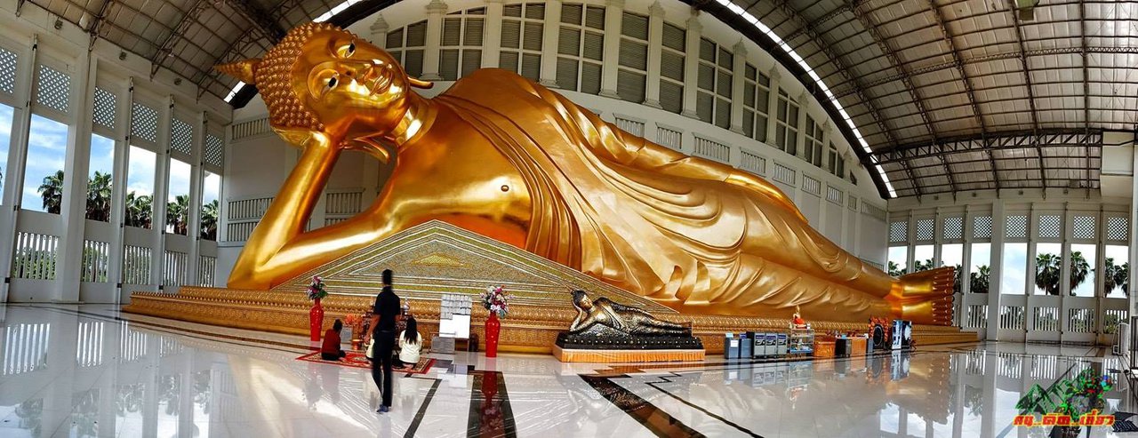 cover Pay homage to the 55-meter-long reclining Buddha at Wat Sukhumaram in Phichit Province.