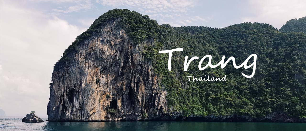 cover Traveling to Trang on a Budget! 

This phrase translates to "Traveling to Trang with money to spare!" It suggests a trip to Trang, Thailand, where you can enjoy yourself without worrying about running out of money.