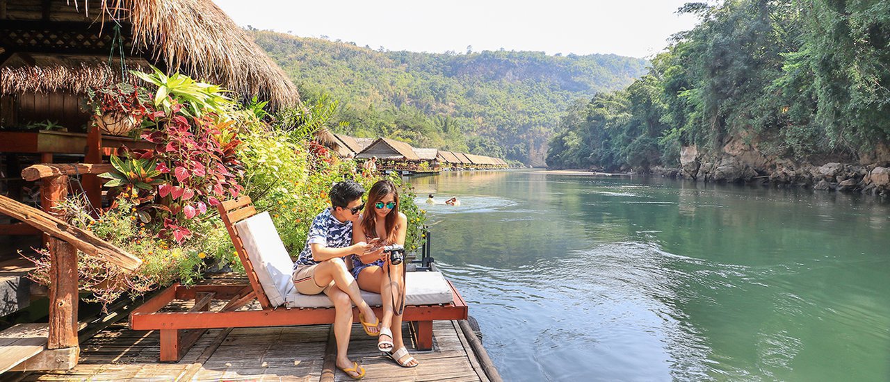 cover Slow Life by the River in Kanchanaburi (A Life on a raft house with no electricity but a lamplight and cold air)